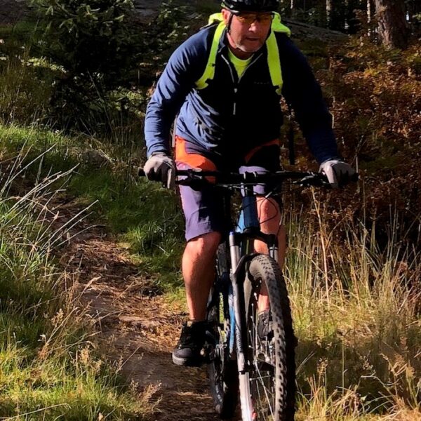 Team member biking at Comrie